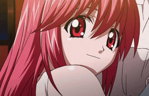 A Close Up Of A Girl With Red Hair GIF