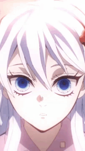 A Close Up Of A Girl With White Hair And Blue Eyes . GIF