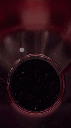 A Close Up Of A Glass Container With A Purple Liquid In It GIF