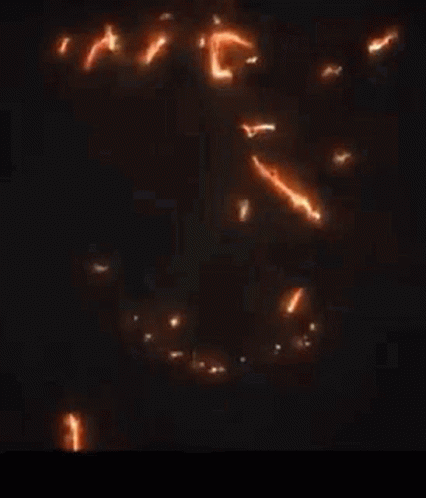 a close up of a glowing dragon on a black background