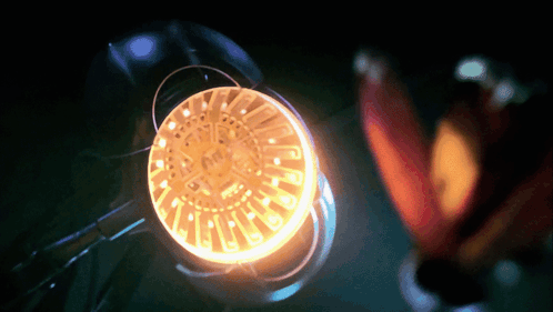 A Close Up Of A Glowing Object With The Letters A And R On It GIF