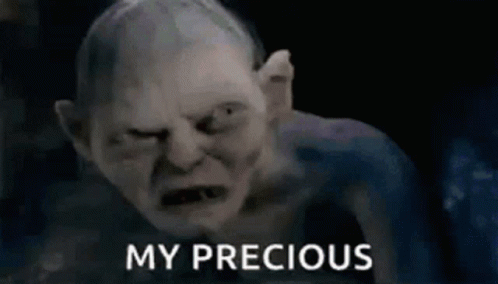 A Close Up Of A Gollum From The Lord Of The Rings With The Words `` My Precious '' Written Next To Him . GIF