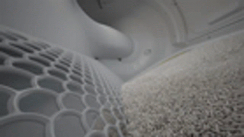A Close Up Of A Gray Carpet In A Room With A Geometric Pattern . GIF