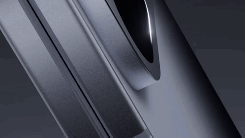 A Close Up Of A Gray Metal Object With A Black Circle In The Middle GIF