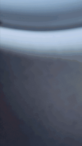 A Close Up Of A Gray Surface With A Few Lines On It GIF