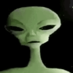 A Close Up Of A Green Alien With Black Eyes And A Long Neck GIF