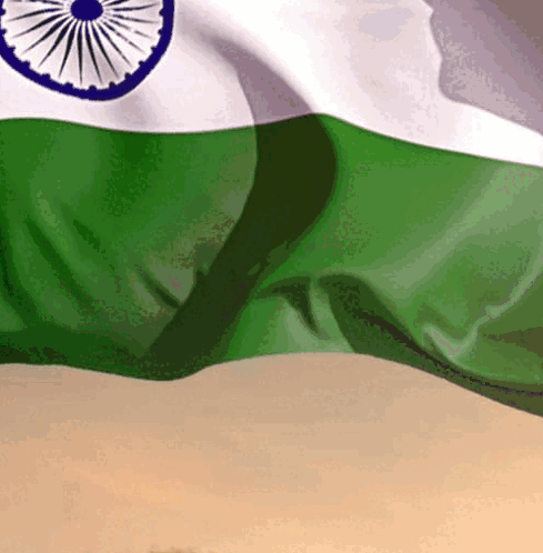 A Close Up Of A Green And White Indian Flag Waving In The Wind GIF