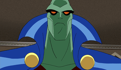 A Close Up Of A Green Cartoon Character With Yellow Eyes GIF