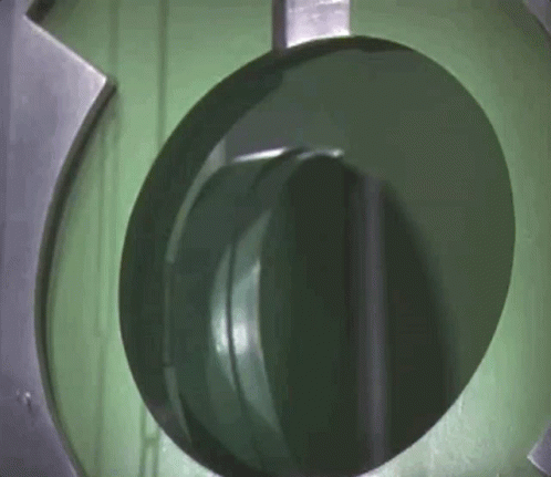 A Close Up Of A Green Circle In A Machine GIF