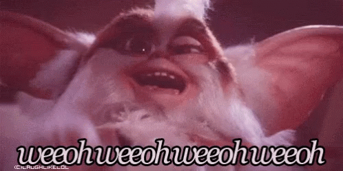 A Close Up Of A Gremlin From The Movie Gremlins Making A Funny Face With Its Mouth Open . GIF