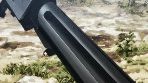 A Close Up Of A Gun In A Field With A Plant In The Background GIF