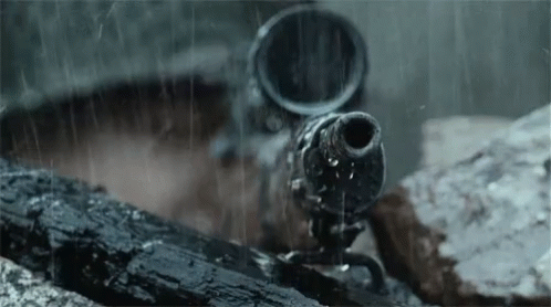 A Close Up Of A Gun In The Rain With Water Coming Out Of It GIF