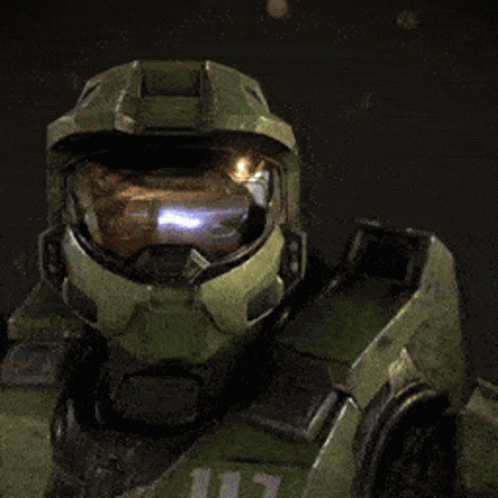A Close Up Of A Halo Soldier 'S Helmet With A Light Coming Out Of It GIF