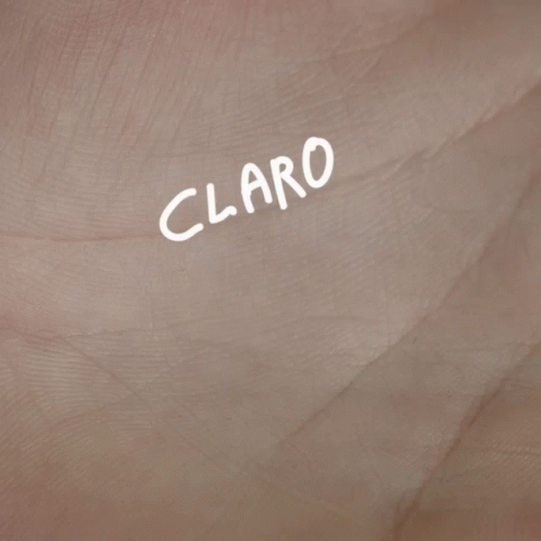 A Close Up Of A Hand With The Words " Claro K Si " Written On It GIF