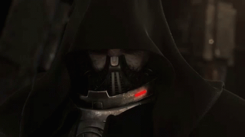 A Close Up Of A Hooded Figure With A Mask On His Face GIF