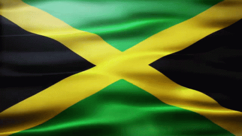 A Close Up Of A Jamaican Flag With A Black Cross In The Middle GIF