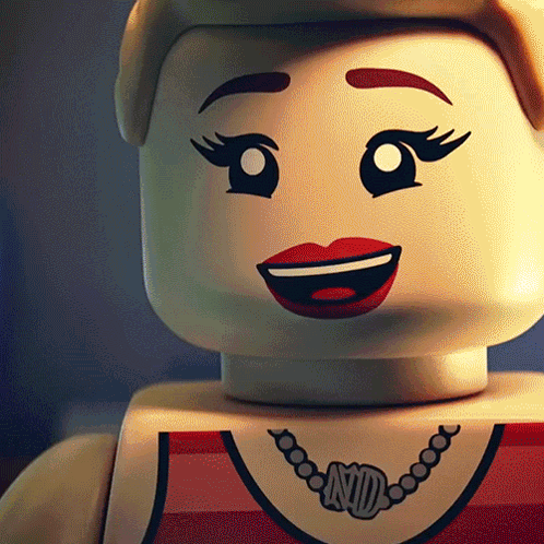 A Close Up Of A Lego Doll With A Necklace That Says Nd On It GIF