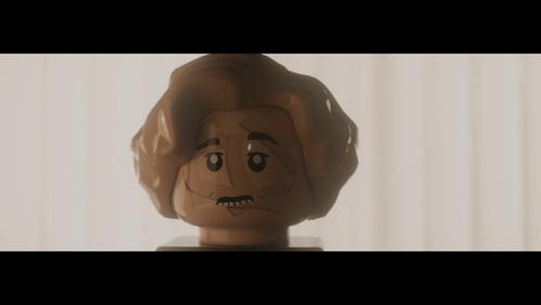 A Close Up Of A Lego Figure 'S Head With A Serious Look On His Face GIF
