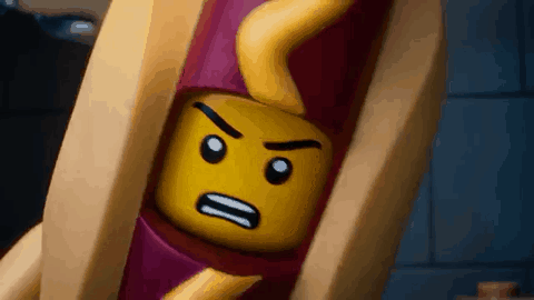 A Close Up Of A Lego Hot Dog With A Face On It GIF