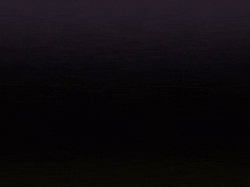 A Close Up Of A Letter M With A Black Background GIF