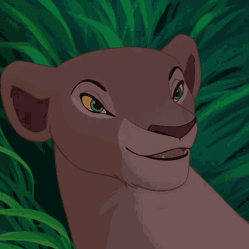 A Close Up Of A Lioness ' Face With A Green Background GIF