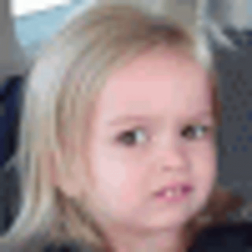 A Close Up Of A Little Girl 'S Face With Blonde Hair . GIF