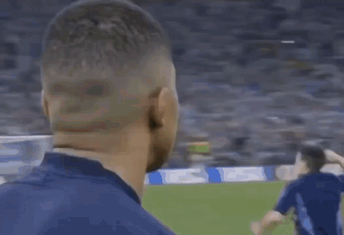 A Close Up Of A Man Covering His Face With His Hand . GIF