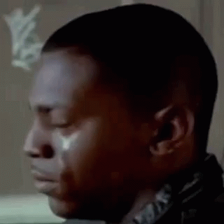 A Close Up Of A Man Crying With A Tear Coming Out Of His Eye . GIF