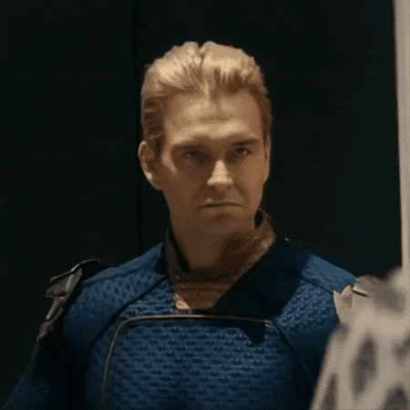 a close up of a man in a blue costume