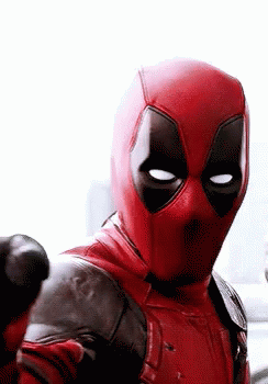 A Close Up Of A Man In A Deadpool Costume Pointing At The Camera . GIF