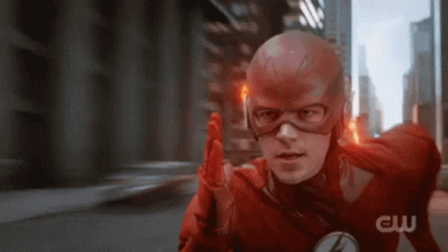 A Close Up Of A Man In A Flash Suit And Mask . GIF
