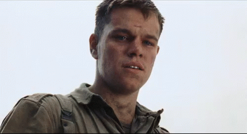 A Close Up Of A Man In A Military Uniform Looking At The Camera With A Serious Look On His Face . GIF