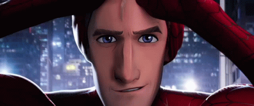 A Close Up Of A Man In A Spiderman Costume Covering His Face With His Hands . GIF