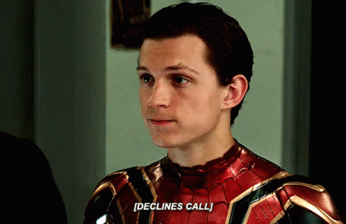 a close up of a man in a spiderman suit saying declines call