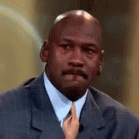 A Close Up Of A Man In A Suit And Tie With A Hand Holding His Tie . GIF