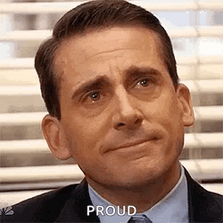A Close Up Of A Man In A Suit And Tie With A Proud Expression On His Face . GIF