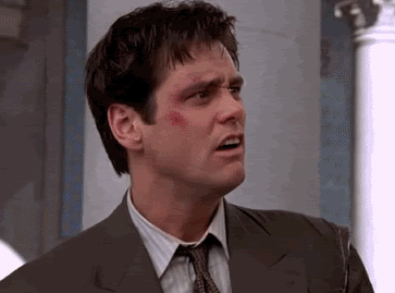 A Close Up Of A Man In A Suit And Tie With A Scratch On His Face . GIF