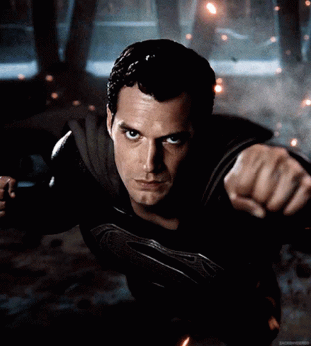 A Close Up Of A Man In A Superman Suit GIF
