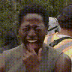A Close Up Of A Man Laughing With A Stormtrooper In The Background GIF