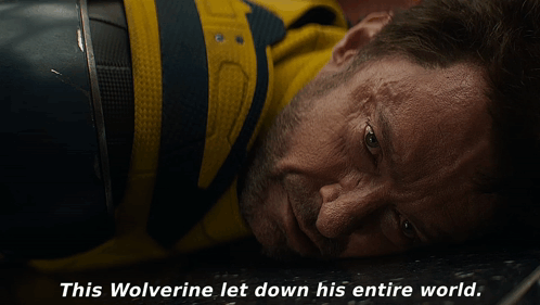 A Close Up Of A Man Laying Down With The Words " This Wolverine Let Down His Entire World " Below Him GIF