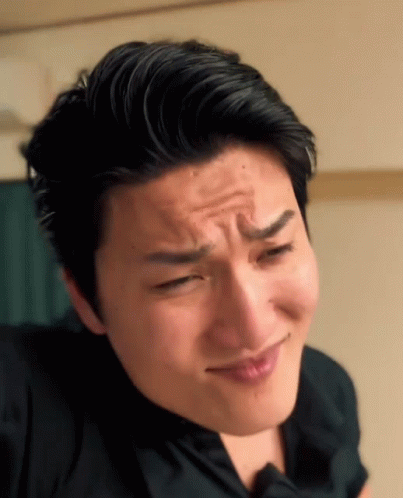 A Close Up Of A Man Making A Face With His Eyes Closed GIF