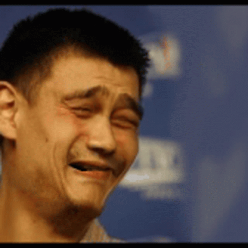 A Close Up Of A Man Making A Face With His Eyes Closed GIF