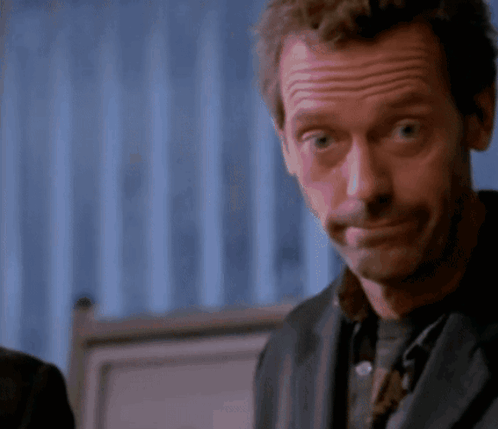 A Close Up Of A Man Making A Face With His Eyes Closed GIF