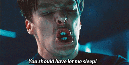 A Close Up Of A Man Making A Face With The Words You Should Have Let Me Sleep GIF