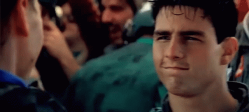 A Close Up Of A Man Making A Funny Face In A Crowd Of People . GIF