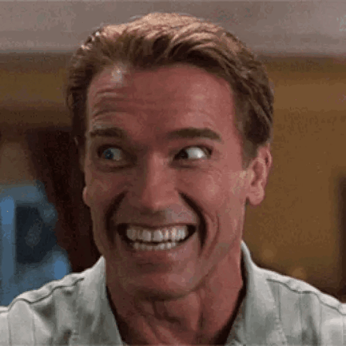 A Close Up Of A Man Making A Funny Face While Smiling . GIF