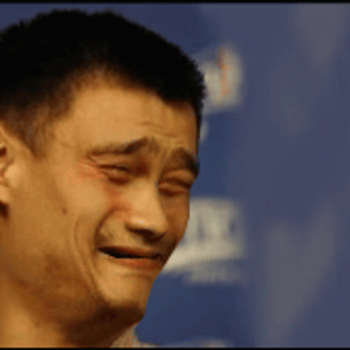 A Close Up Of A Man Making A Funny Face With A Blue Background GIF