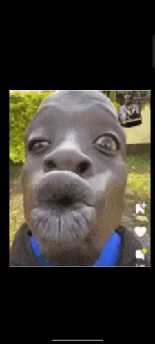 A Close Up Of A Man Making A Funny Face With A Blue Shirt . GIF