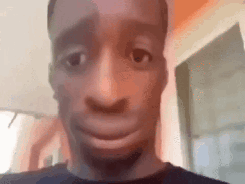 A Close Up Of A Man Making A Funny Face With His Mouth Open . GIF