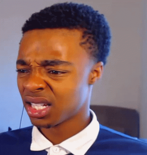 A Close Up Of A Man Making A Funny Face With His Mouth Open GIF